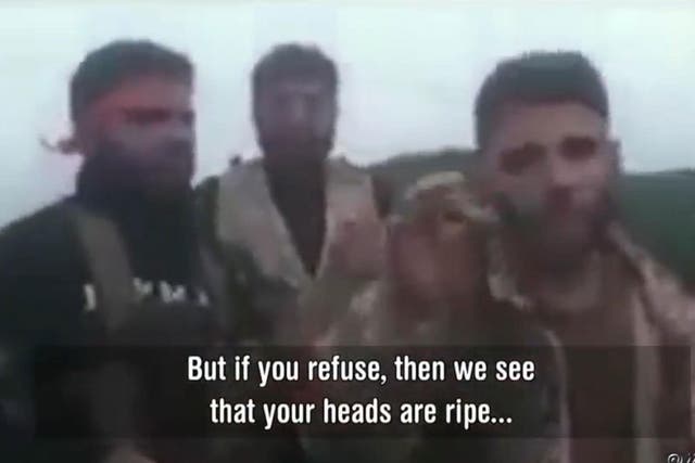 Footage verified by the Syrian Observatory showed Syrian Turkish allies threatening Kurds with beheading