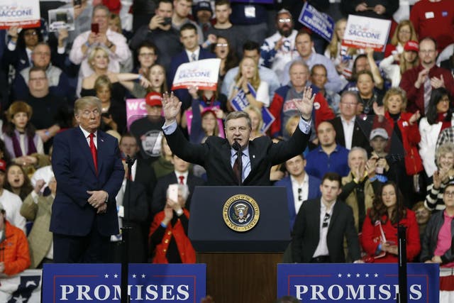Republican Rick Saccone acknowledges the crowd during a campaign rally with President Donald Trump