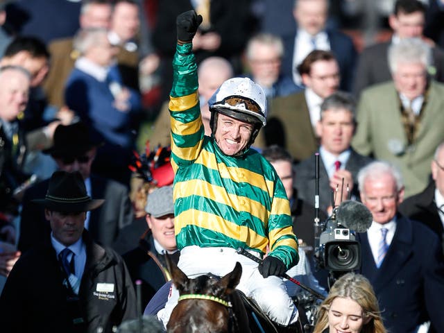 Barry Geraghty celebrates after riding Buveur D'Air to victory on the Champion Hurdle at Cheltenham