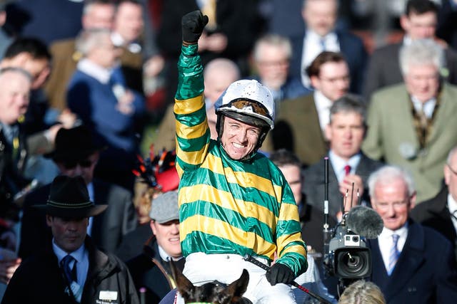 Barry Geraghty celebrates after riding Buveur D'Air to victory on the Champion Hurdle at Cheltenham