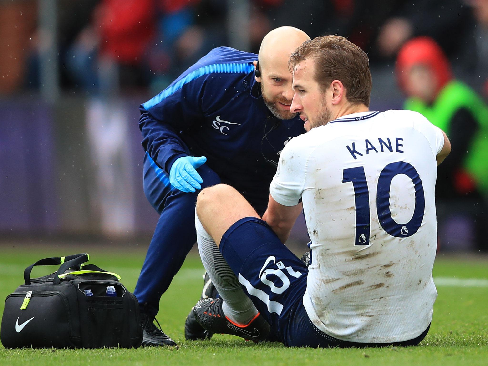 Harry Kane receives treatment after his clash with Asmir Begovic during Sunday's win