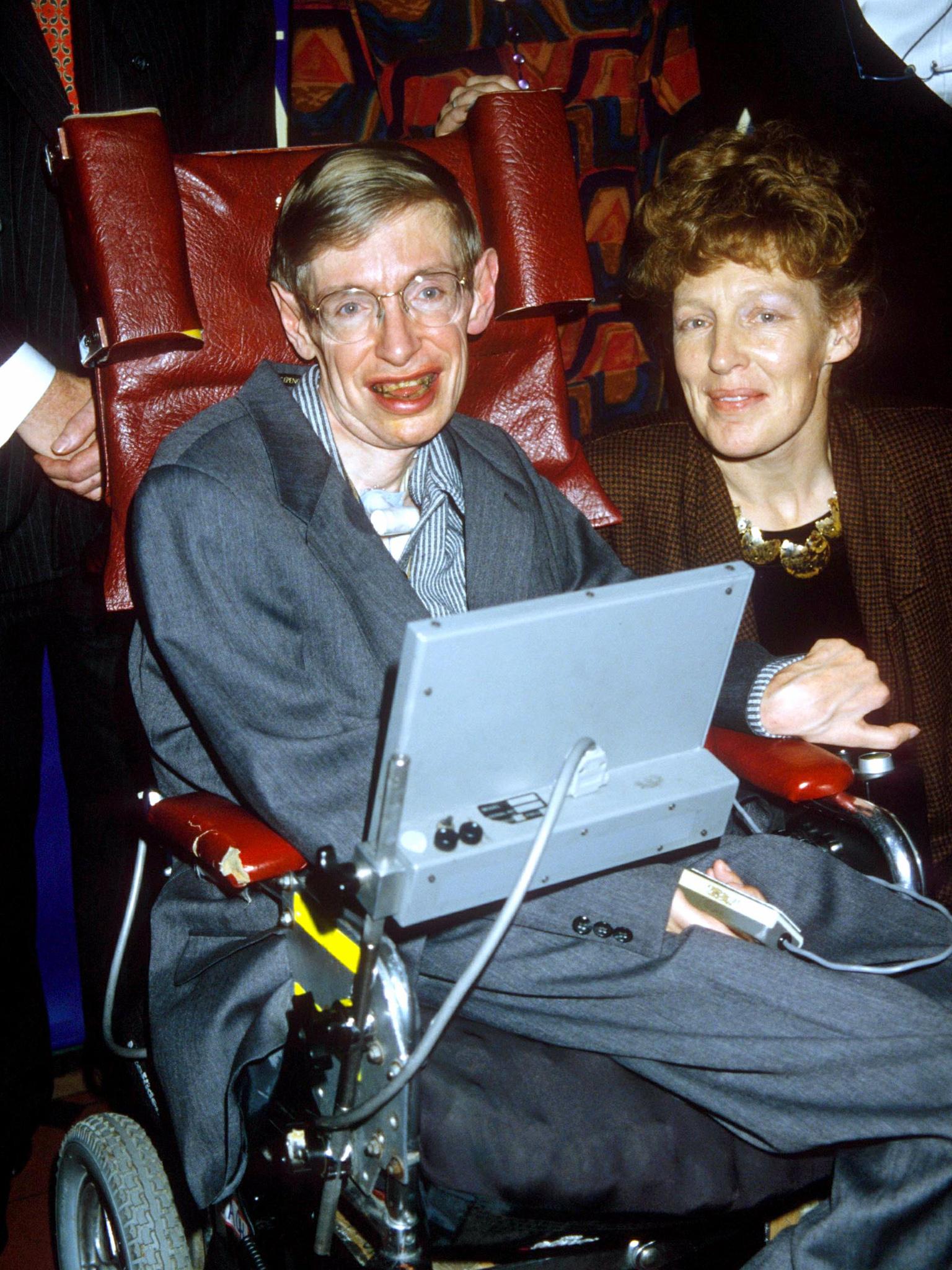 Hawking and his new bride Elaine Mason pose for pictures after their wedding in 1995.(Rex)