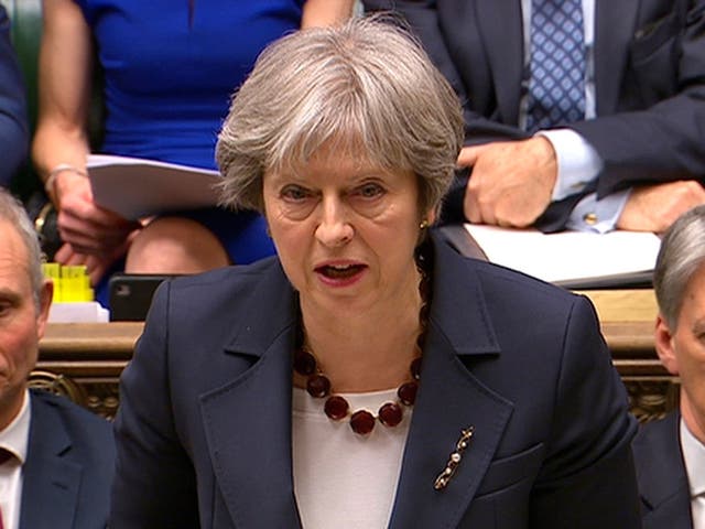 Britain's Prime Minister Theresa May addresses the House of Commons on her government's reaction to the poisoning of former Russian intelligence officer Sergei Skripal and his daughter Yulia in Salisbury