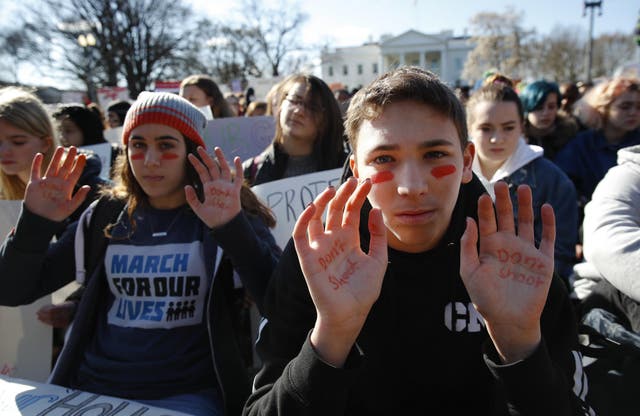 Students rally in front of the White House in Washington, Wednesday, March 14, 2018