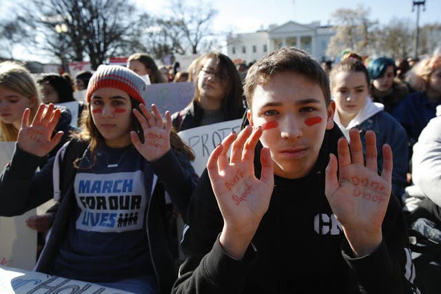 Students rally in front of the White House in Washington, Wednesday, March 14, 2018