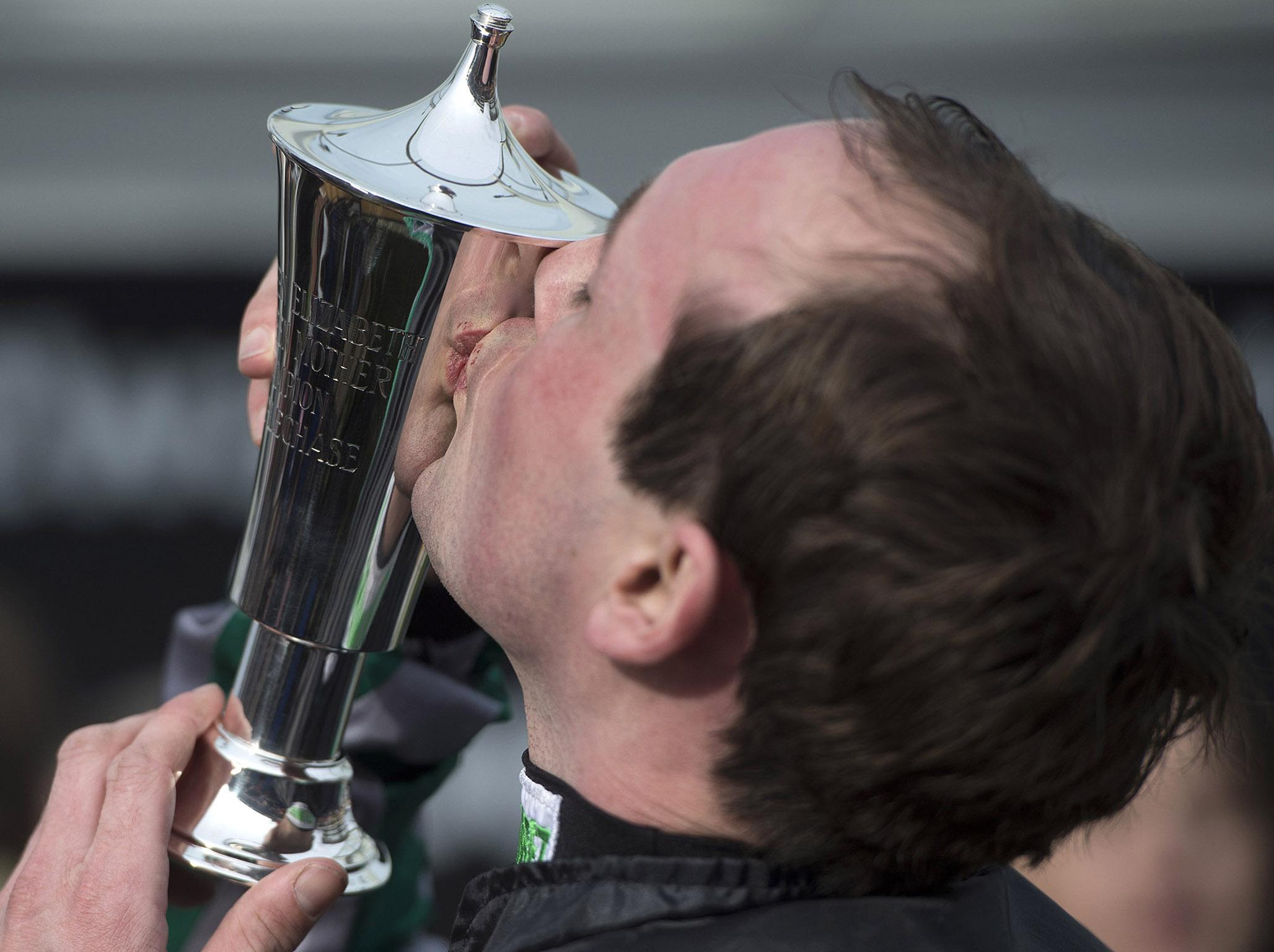 Nico de Joinville kisses the Champions Chase trophy