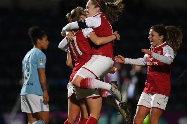 Arsenal's players celebrate after Vivianne Miedema put the side in front