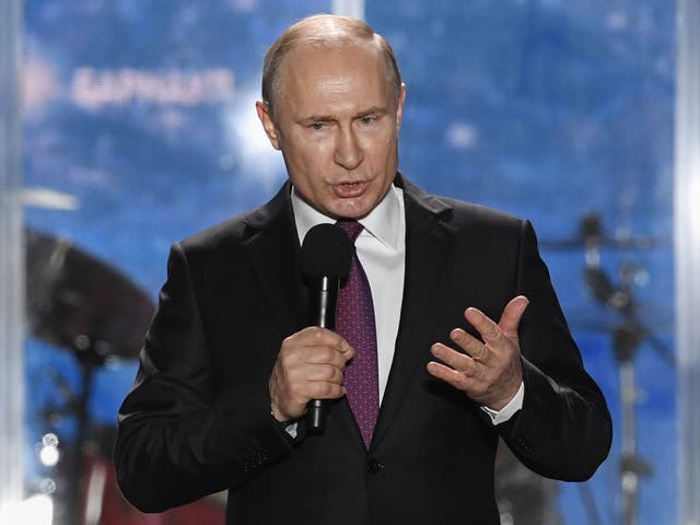 Vladimir Putin, the Russian President, addresses supporters during a rally celebrating the fourth anniversary of Russia's annexation of Crimea at Sevastopol's Nakhimov Square