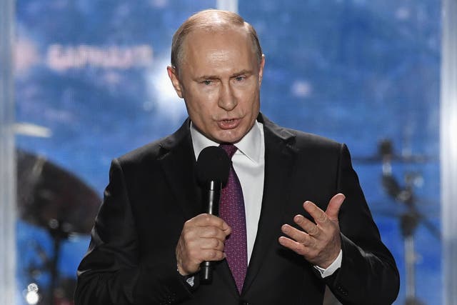 Vladimir Putin, the Russian President, addresses supporters during a rally celebrating the fourth anniversary of Russia's annexation of Crimea at Sevastopol's Nakhimov Square