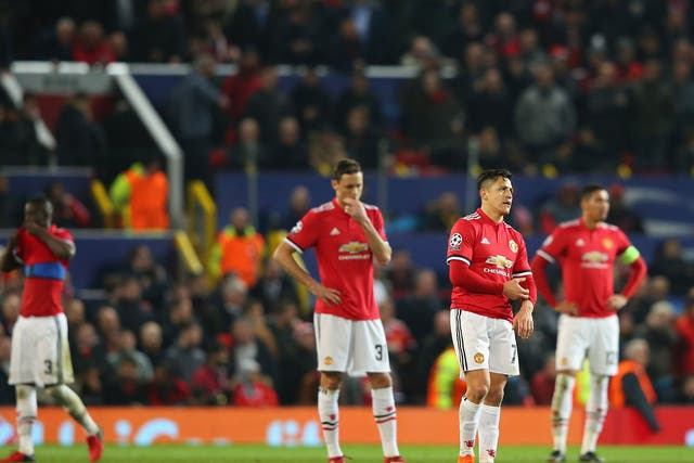 United's players react after their surprise defeat at Old Trafford