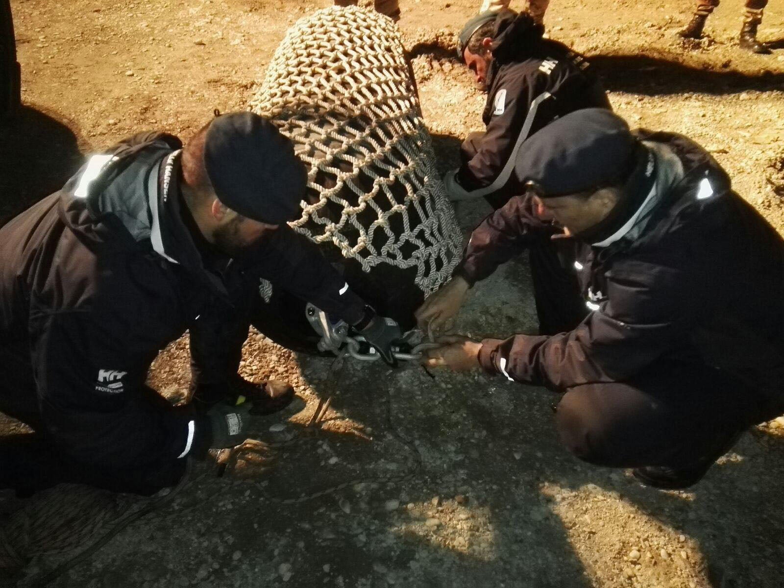 Italian Army unit bomb disposal experts working on the World War II bomb
