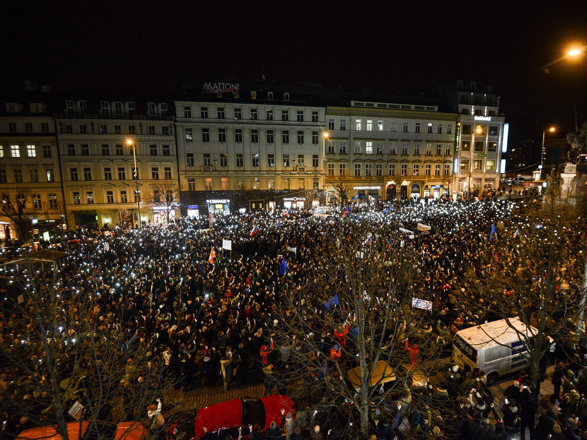Demonstrators light their mobiles as they protest against Milos Zeman’s attack on the public broadcaster Czech Television at Wenceslas Square
