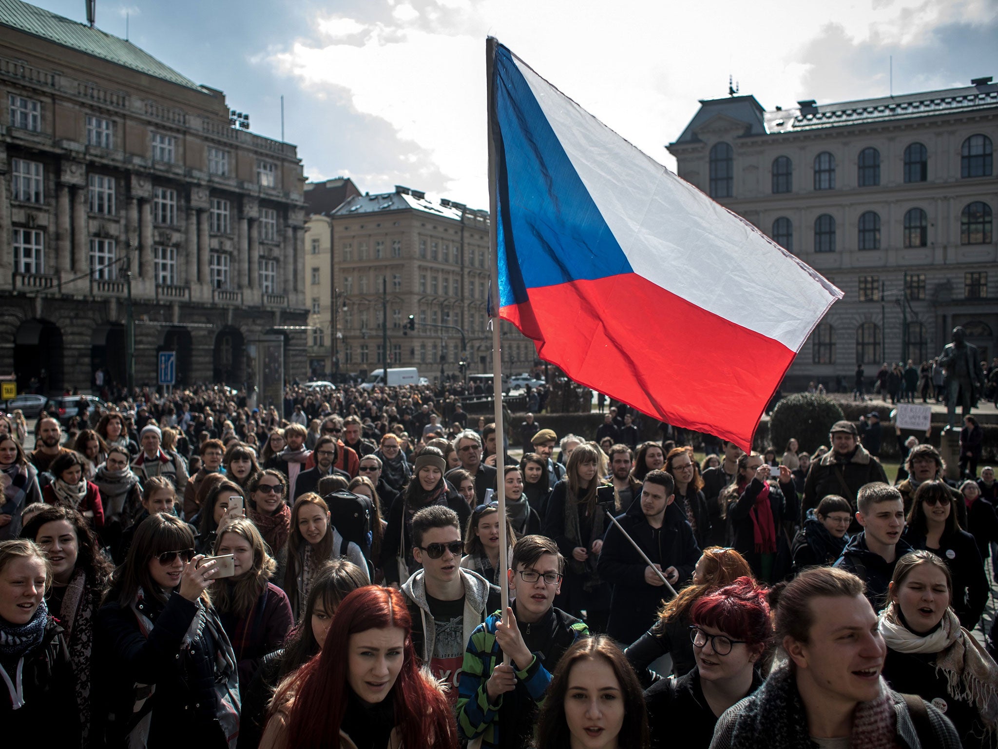 Students sing the Czech national anthem as they gathered in further protests