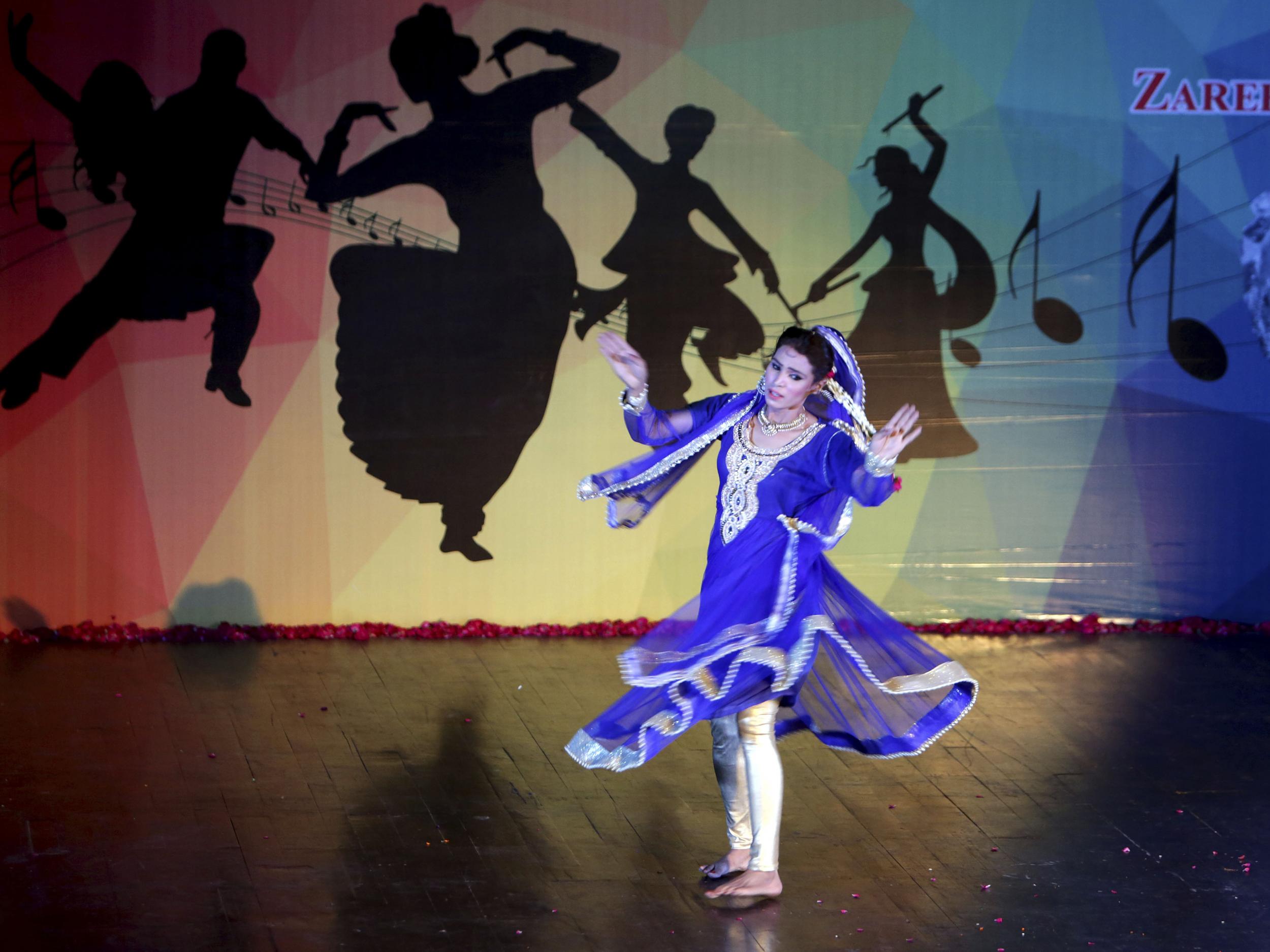 A Pakistani dancer performs at a cultural centre in Lahore, Pakistan,