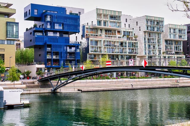 Modern apartment buildings along the Saone canal in Lyon’s Confluence district