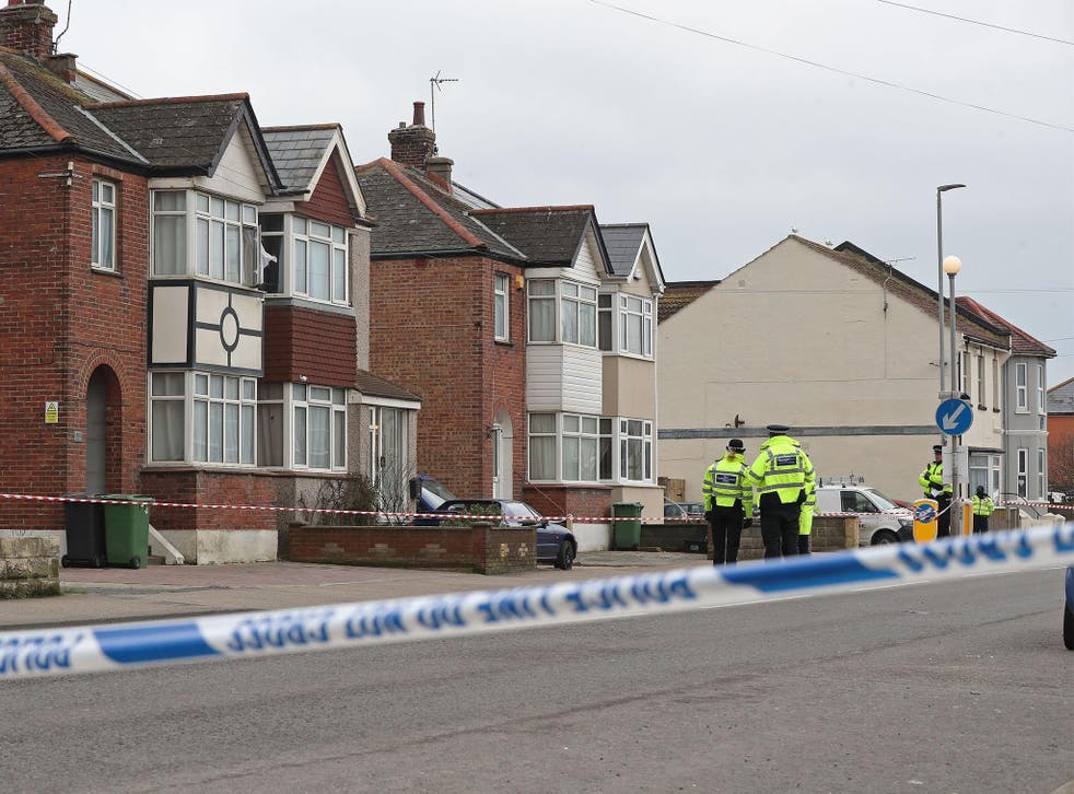 Police at the scene where two women were shot dead at a house in St Leonards, East Sussex