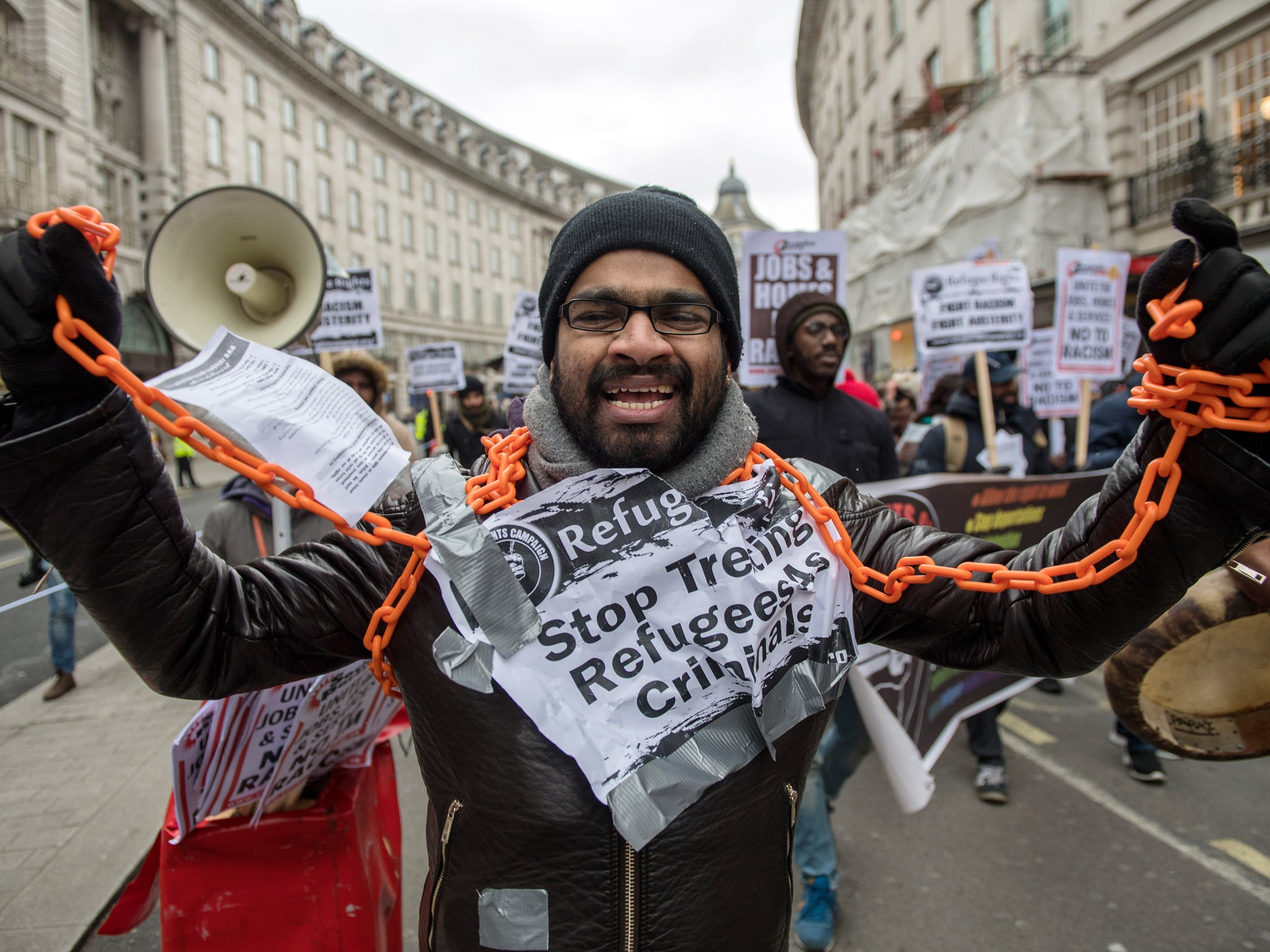 An anti-racism protester with chains around his neck