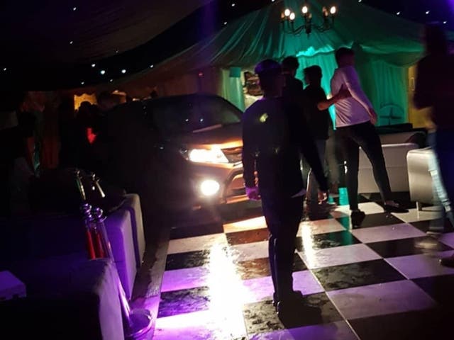 Footage posted on social media shows a black 4x4, headlights still shining, on a chequered dancefloor inside a marquee at Blake's nightclub