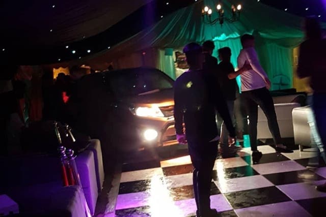 Footage posted on social media shows a black 4x4, headlights still shining, on a chequered dancefloor inside a marquee at Blake's nightclub
