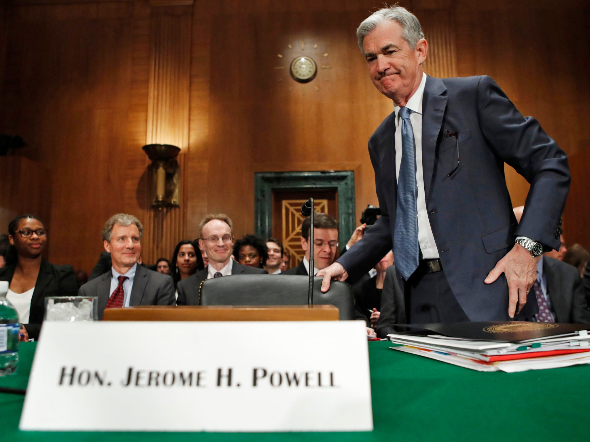 Federal Reserve Chairman Jerome Powell takes his seat before making the semiannual monetary policy report to the Senate Banking Committee on Capitol Hill in Washington.