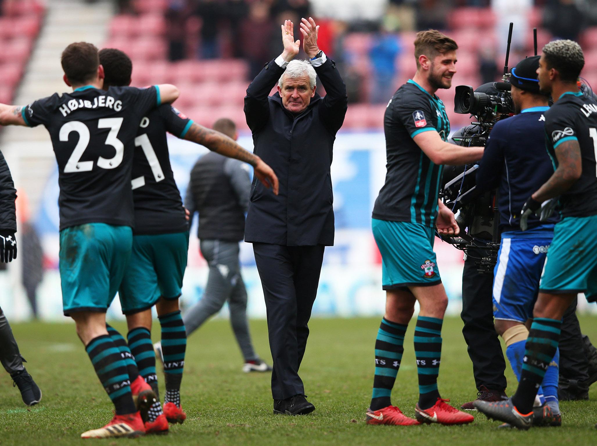 Mark Hughes applauds the Southampton supporters