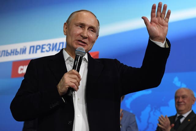 Russian President Vladimir Putin speaks during a meeting with supporters at his campaign headquarters in Moscow