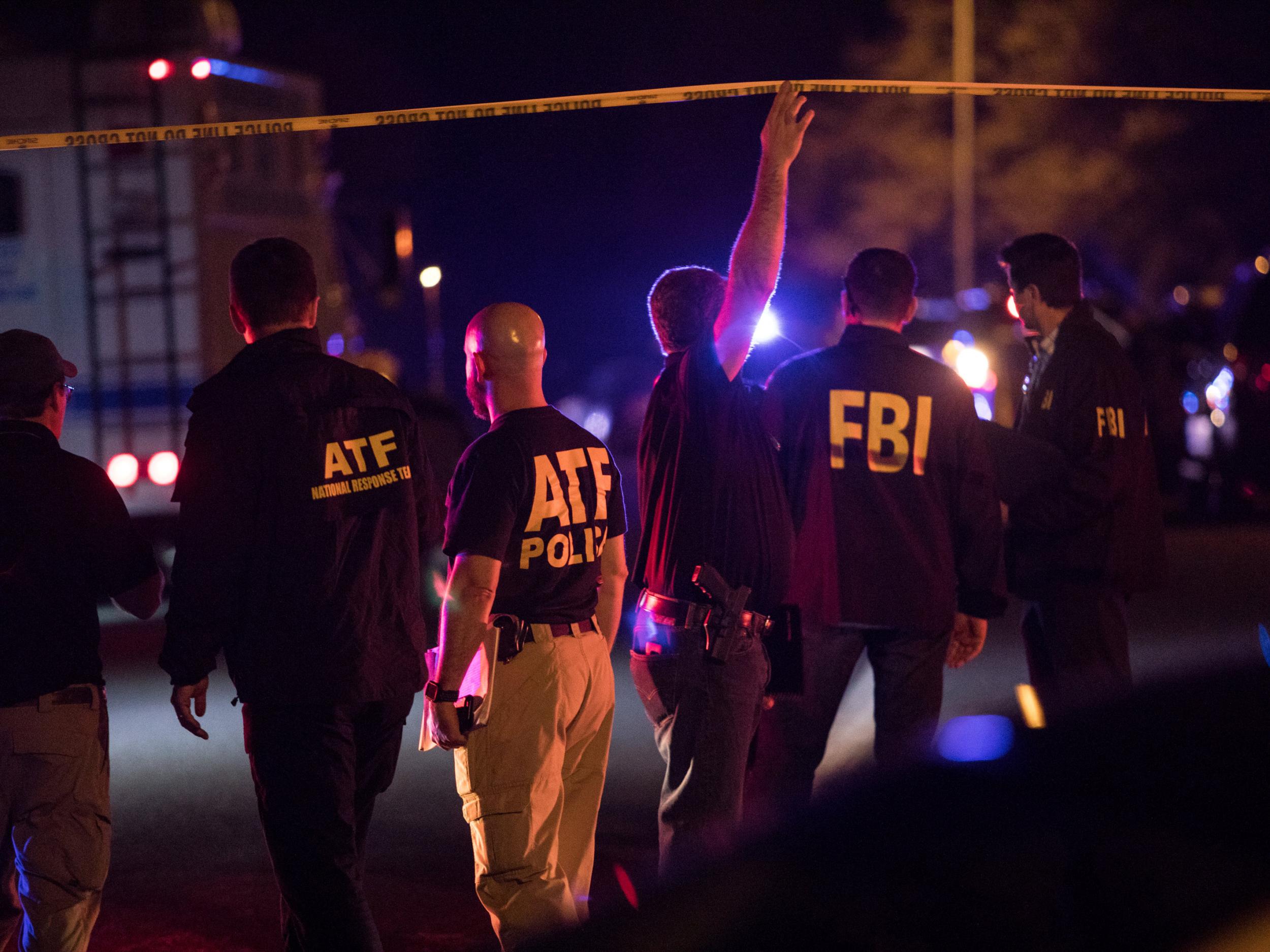 Police and FBI investigators at a cordon near the site of an explosion in south-west Austin