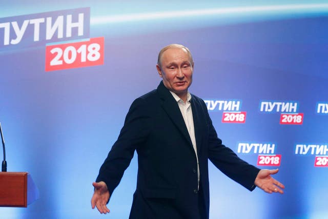 President Vladimir Putin meets with the media at his campaign headquarters in Moscow on Sunday night