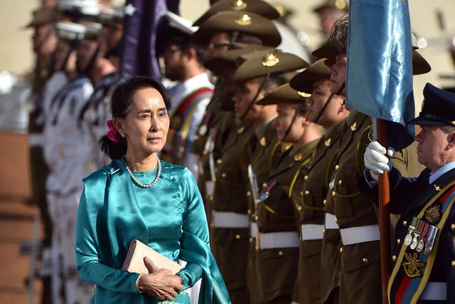 Aung San Suu Kyi arrives in Canberra to be met by a military honour guard and Australia's Prime Minister, Malcolm Turnbull