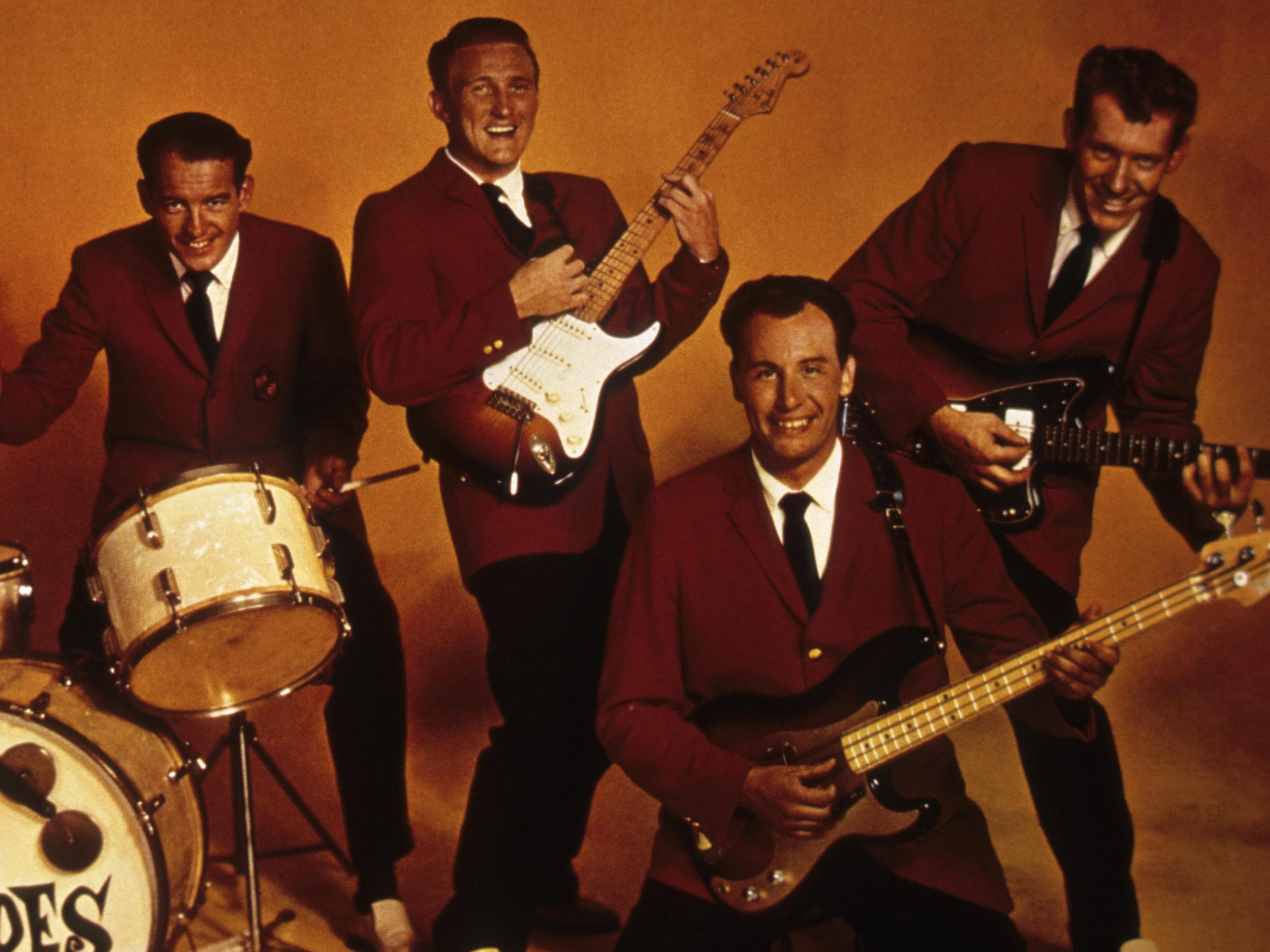 Edwards (third from left) with the band in their heyday. His nimble, melodic guitar work spawned many imitators