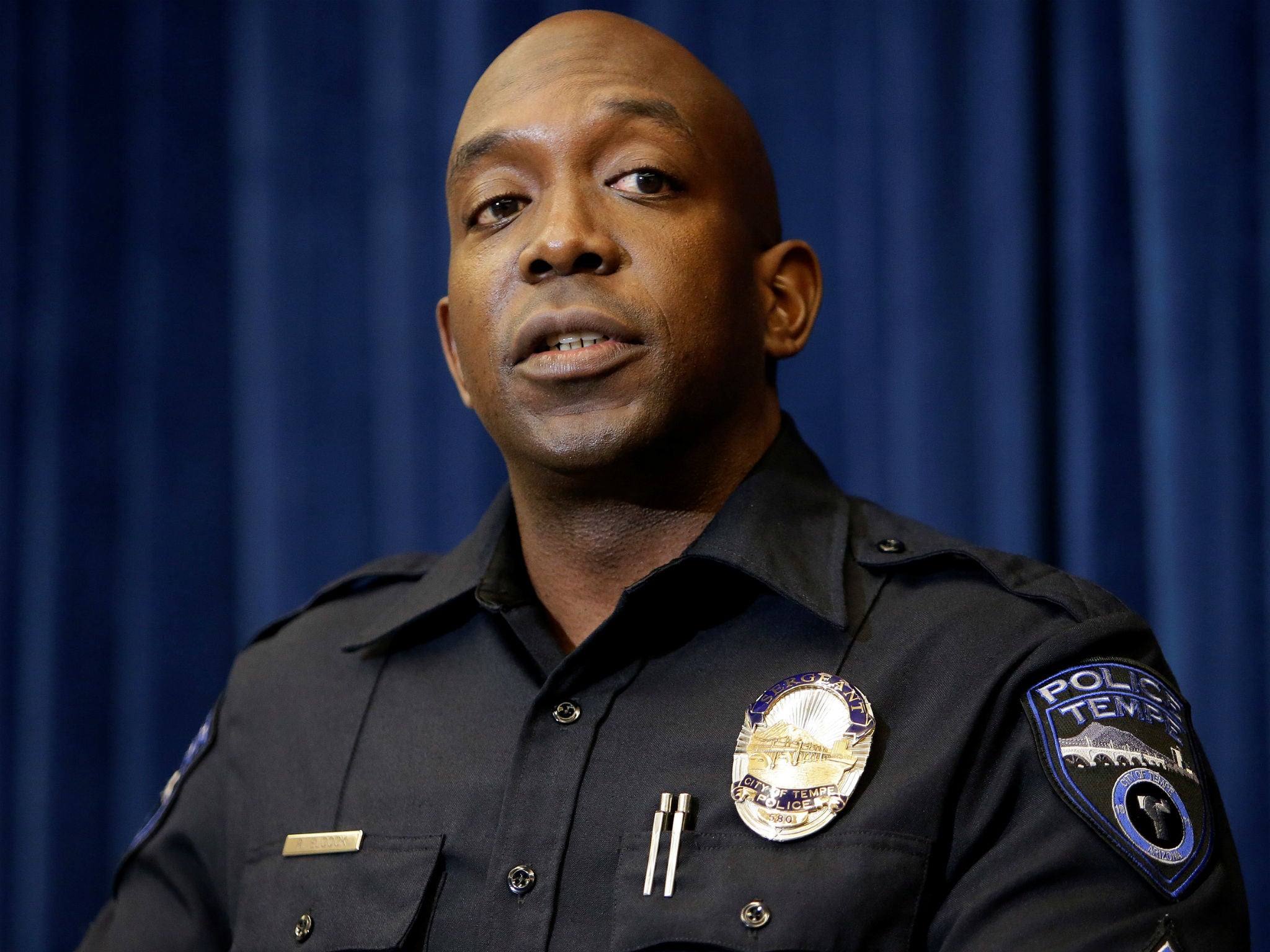 Tempe Police Sergeant Ronald Elcock speaks to the media after a female pedestrian was struck and killed by an Uber self-driving sport utility vehicle in Tempe, Arizona