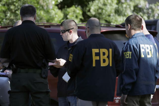 FBI agents work at a scene near the site of Sunday's explosion