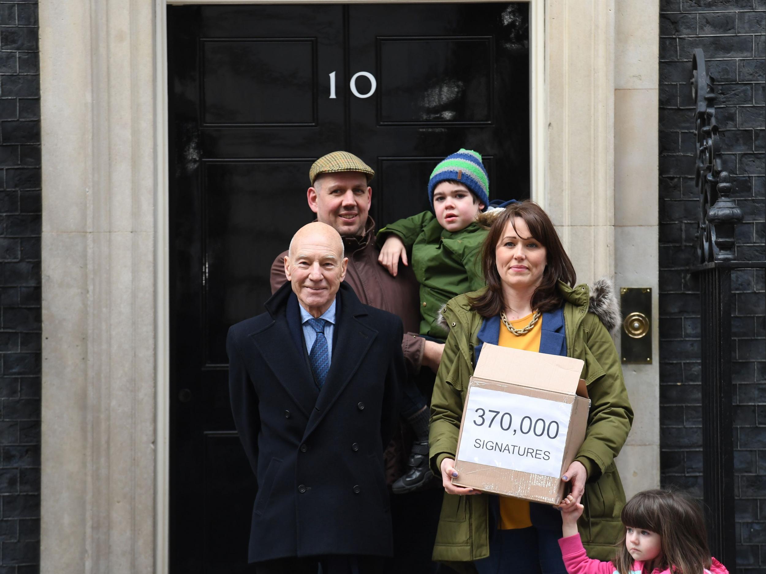 Six-year-old Alfie Dingley, his parents Drew Dingley and Hannah Deacon and actor Sir Patrick Stewart (left) walk up Whitehall in London before handing in a petition to Number 10 Downing Street asking for Alfie to be given medicinal cannabis to treat his epilepsy.