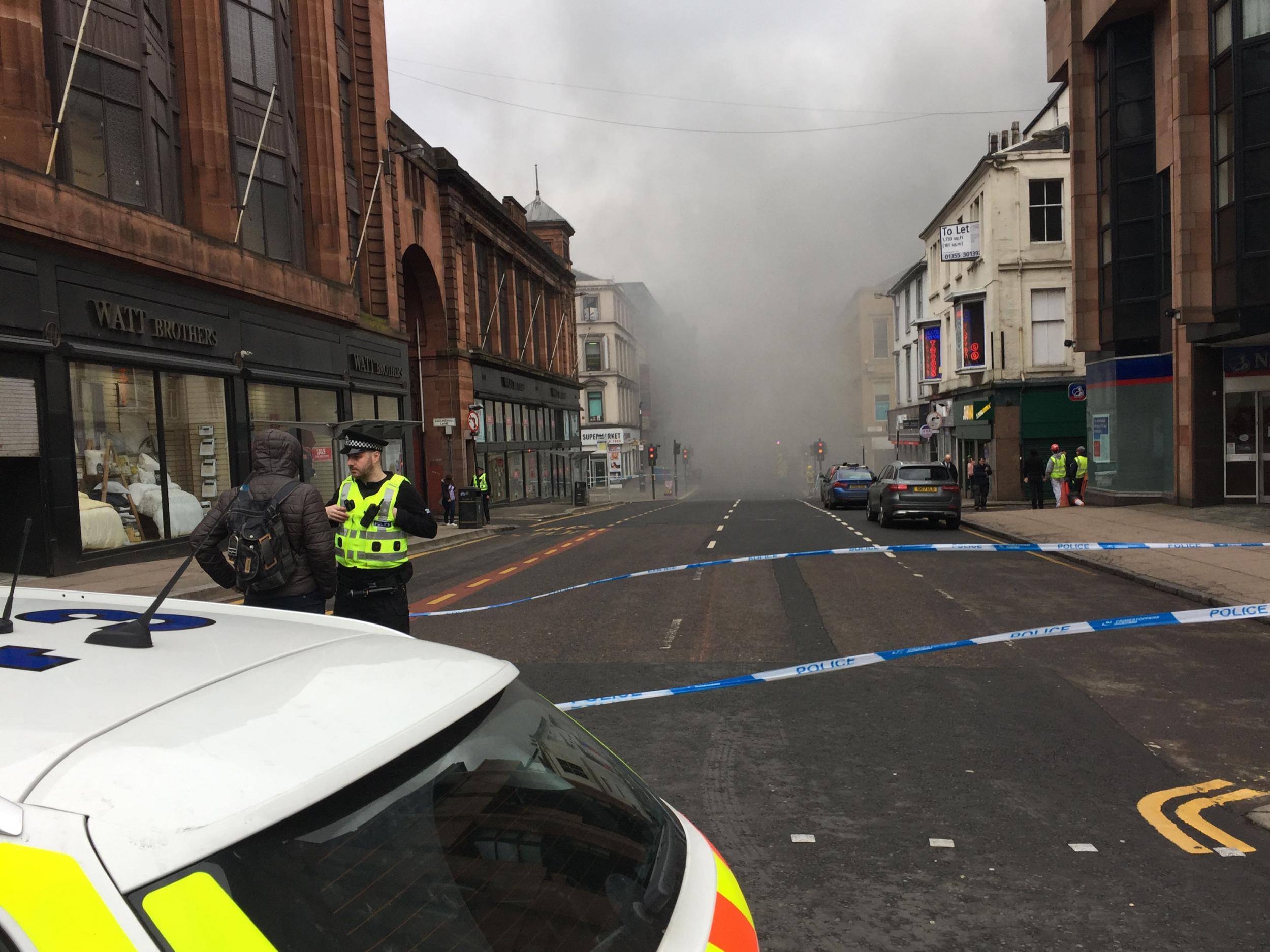 The scene in Glasgow city centre where firefighters are tackling a large blaze in Sauchiehall Street near the junction with Hope Street