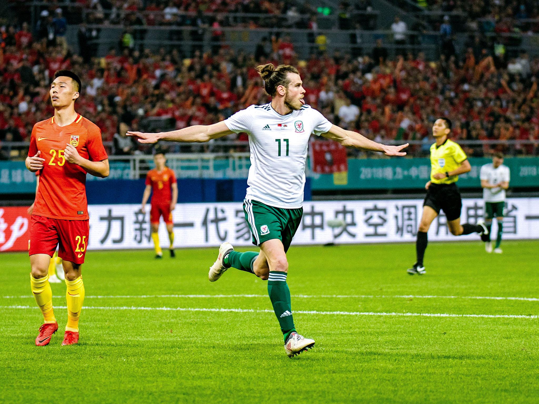 Gareth Bales celebrates scoring for Wales