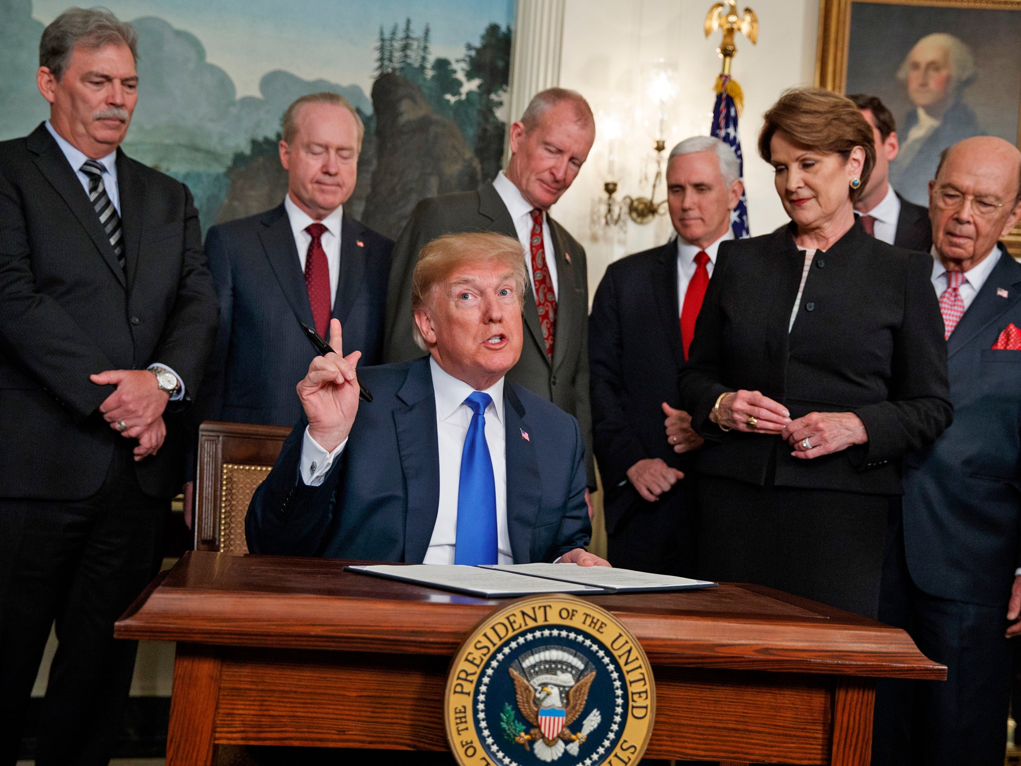 President Donald Trump speaks before he signs a presidential memorandum imposing tariffs and investment restrictions on China