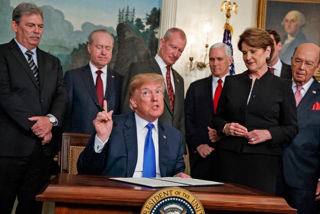 President Donald Trump speaks before he signs a presidential memorandum imposing tariffs and investment restrictions on China