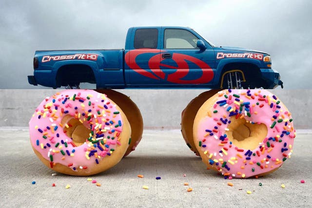 A truck with iced doughnuts for wheels
