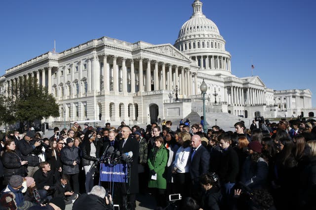 Students and parents from Marjory Stoneman Douglas High School join Democrat politicians at a Capitol Hill press conference ahead of the marches