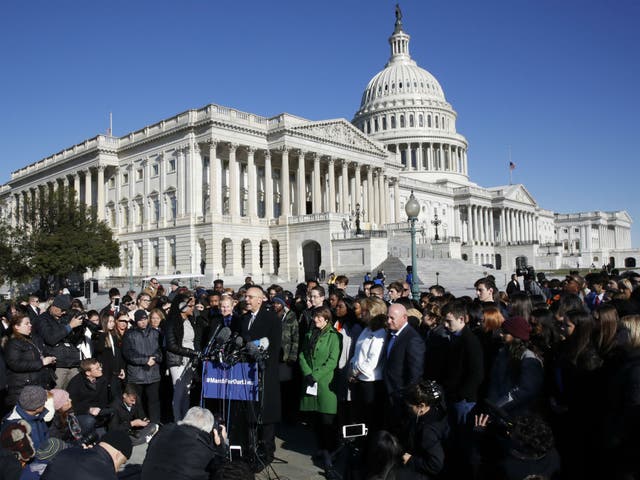 Students and parents from Marjory Stoneman Douglas High School join Democrat politicians at a Capitol Hill press conference ahead of the marches