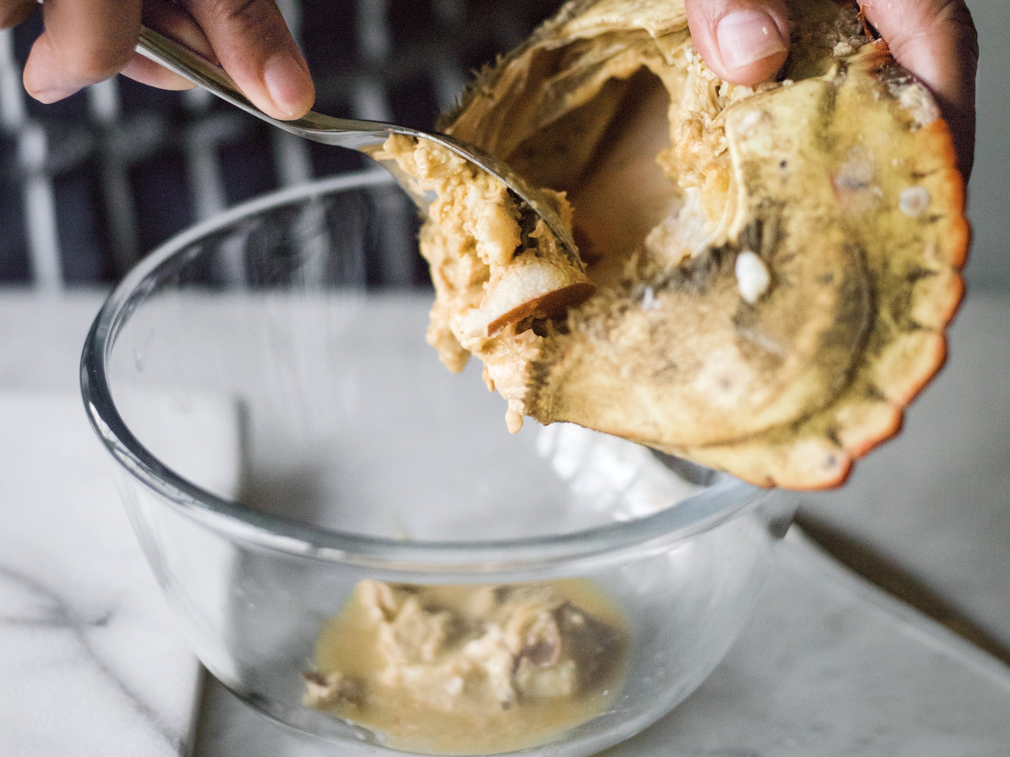 3. Scoop out the brown meat into a bowl