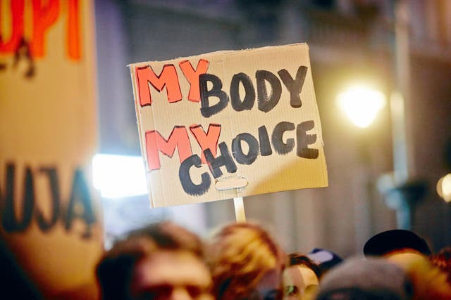 People gather to protest against plans to further restrict abortion laws in Lodz, Poland