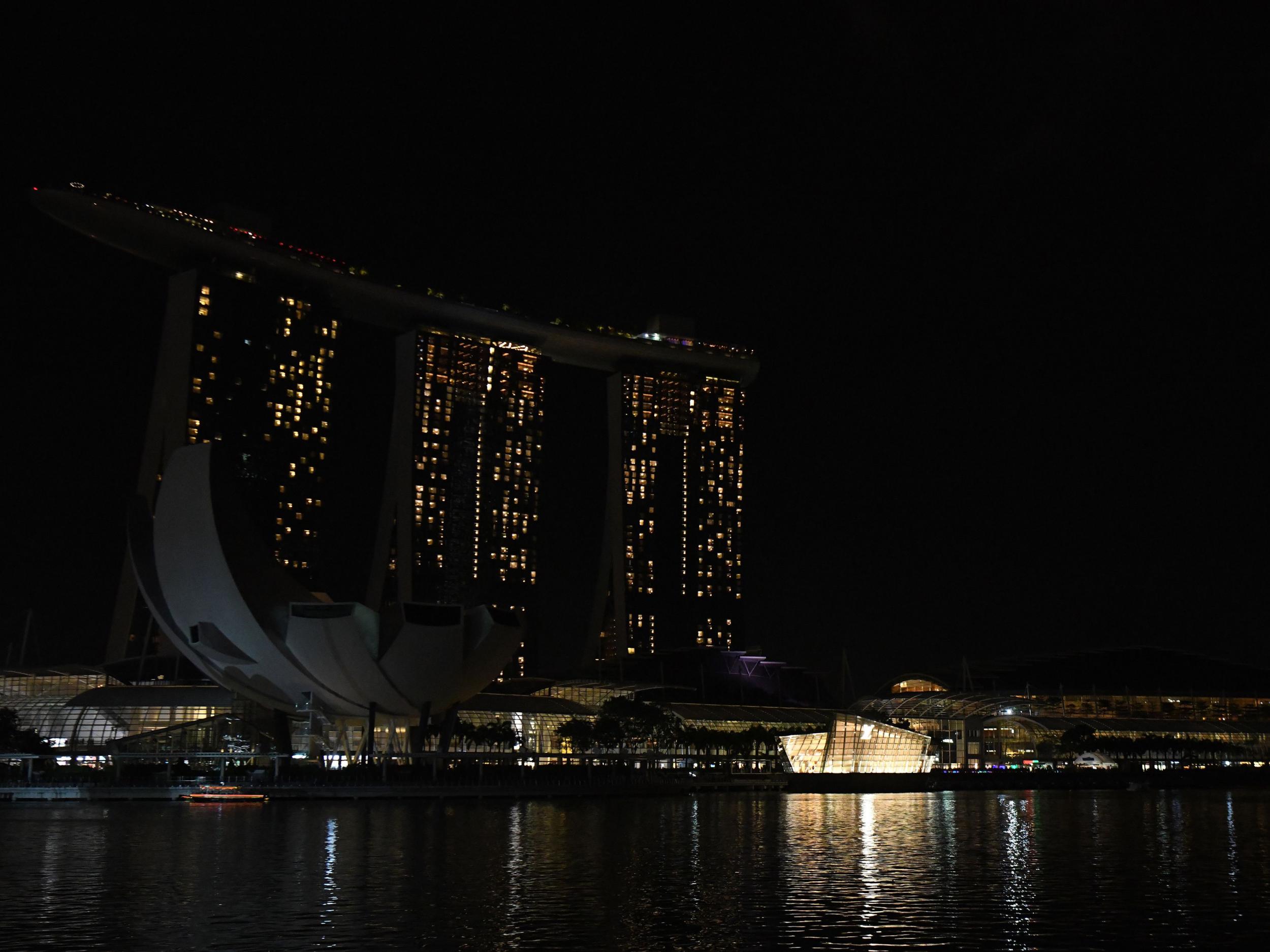 Marina Bay Sands hotel and resort with the lights switched off during the Earth Hour environmental campaign in Singapore