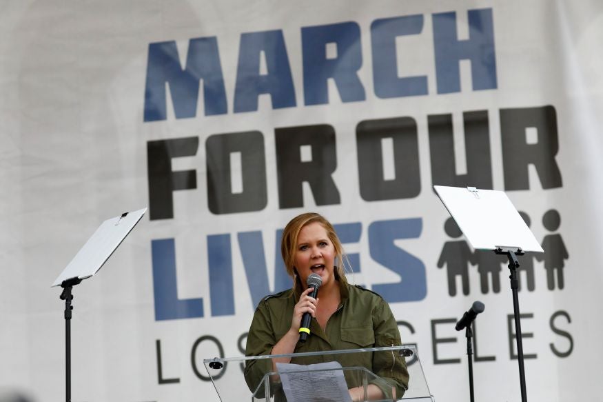Comedienne Amy Schumer addresses the 50,000-strong crowd in LA