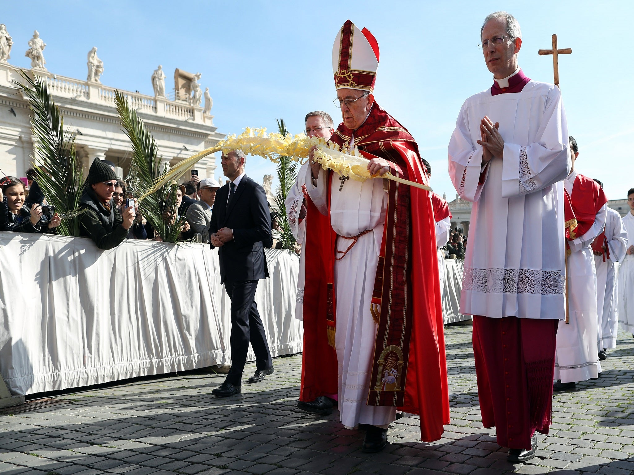 Pope Francis arrives in procession at St Peter’s Square during the Palm Sunday Mass