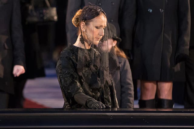 Public mourning: Céline Dion pauses at the casket of her late husband René Angélil – his funeral was livestreamed