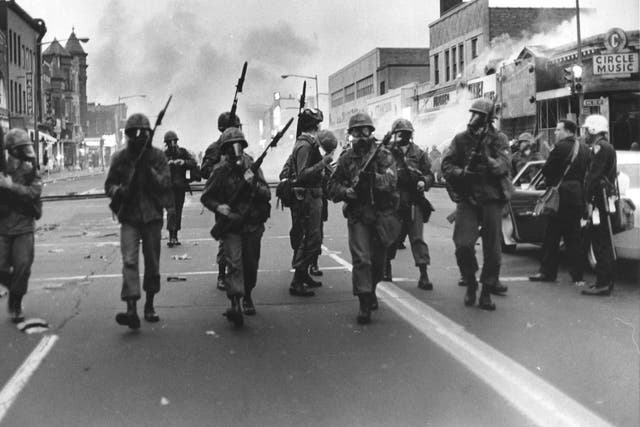 Cavalry troops sweep along High Street in Washington during the 1968 riots