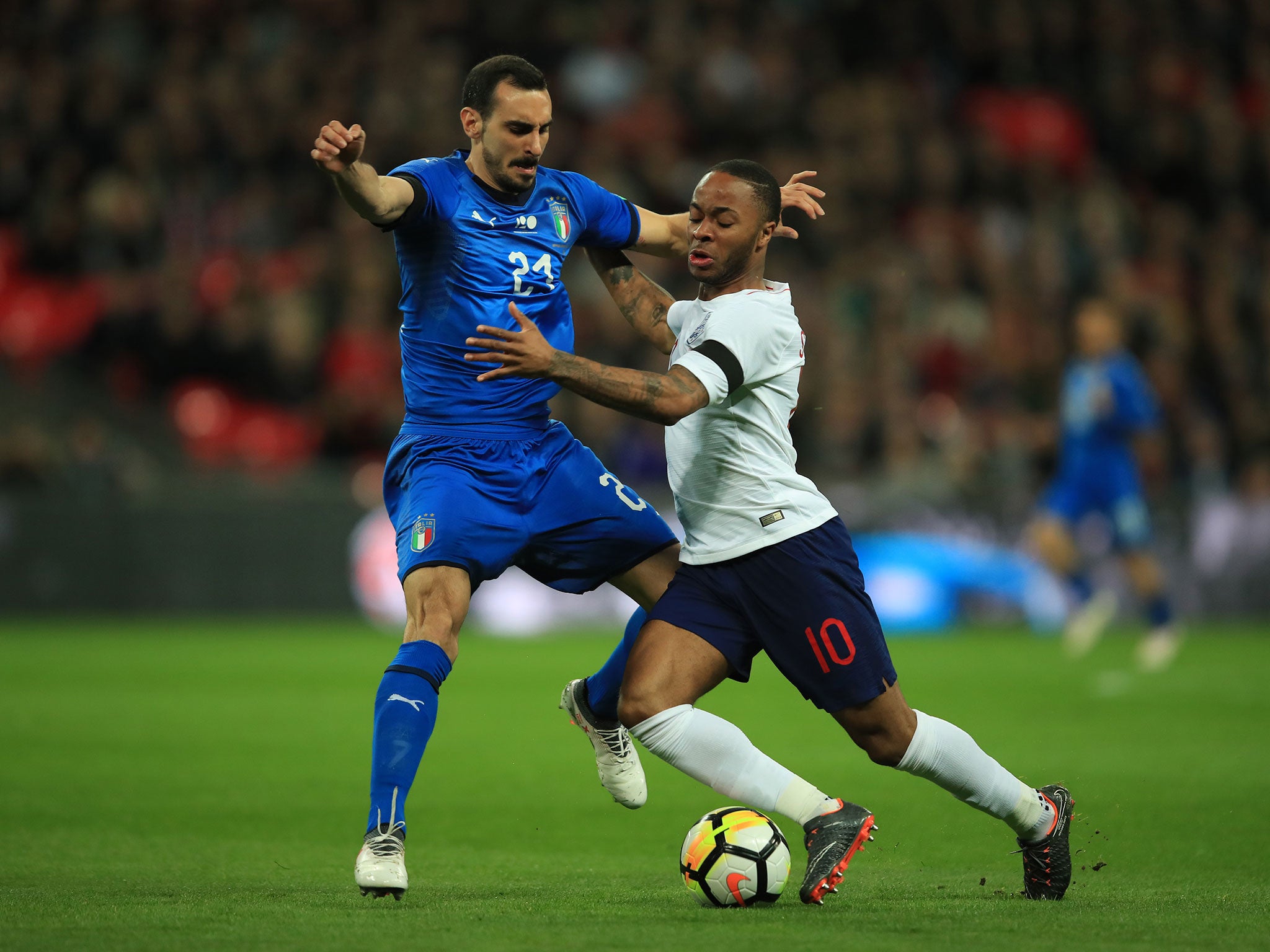 Raheem Sterling tussles for possession with Davide Zappacosta