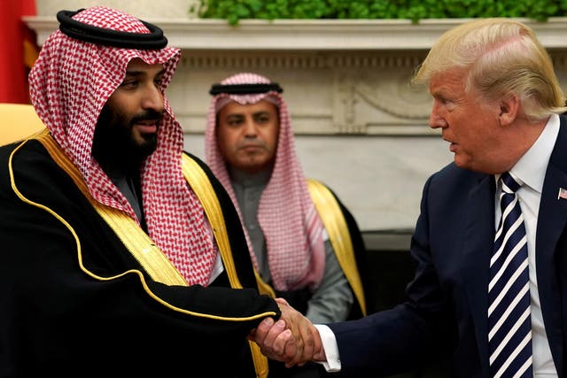 US President Donald Trump shakes hands with Saudi Arabia's Crown Prince Mohammad bin Salman in the Oval Office at the White House in Washington DC on 20 March 2018