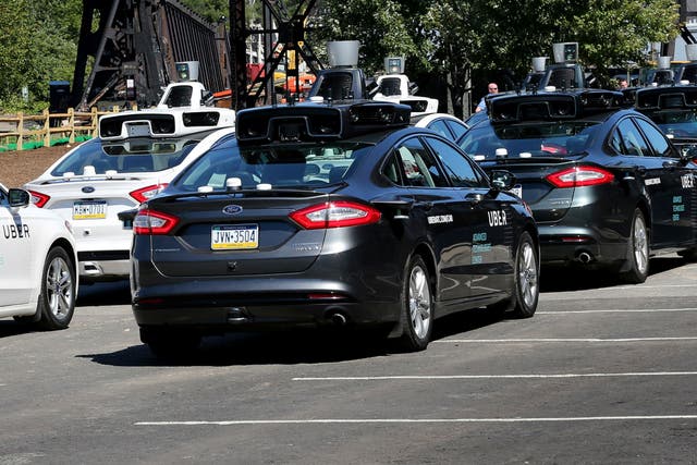 A fleet of Uber’s Ford Fusion driverless cars are shown during a demonstration of self-driving automotive technology in Pittsburgh, Pennsylvania